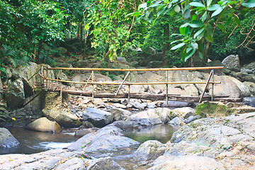 Image showing wooden bridge over the stream