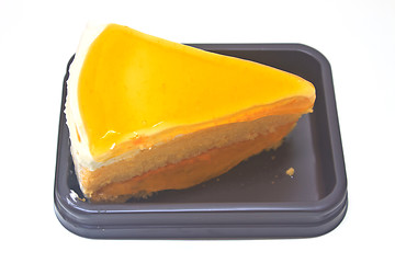 Image showing  Orange Cheesecake in plate on background