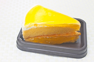 Image showing Orange Cheesecake in plate on background