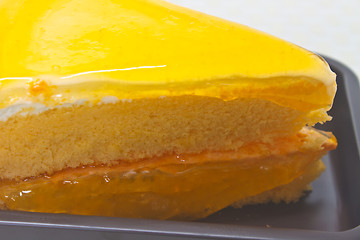 Image showing Orange Cheesecake in plate on background