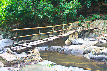 Image showing wooden bridge over the stream