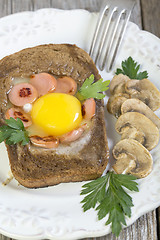 Image showing Scrambled eggs with sausage and mushrooms.
