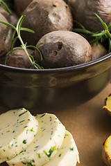 Image showing  baked potatoes with herbs butter