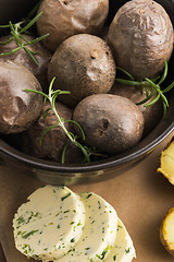 Image showing  baked potatoes with herbs butter