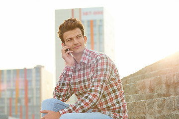 Image showing Man with cellphone outdoors