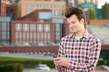 Image showing Man with cellphone outdoors