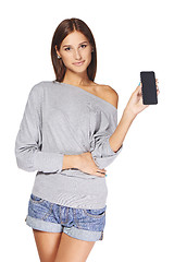 Image showing Young woman showing mobile cell phone