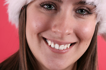 Image showing Cute woman in fuzzy Christmas hat