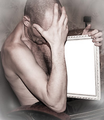 Image showing  Man holds a picture