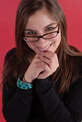 Image showing Young woman in glasses smiling