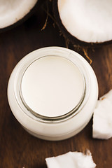 Image showing Coconut Milk in a glass on dark wooden background