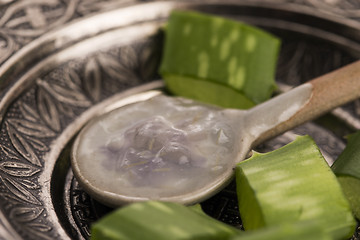 Image showing aloe vera juice with fresh leaves 