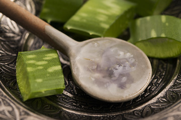 Image showing aloe vera juice with fresh leaves 