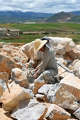 Image showing Man chiseling stones for temple