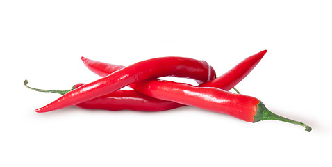 Image showing Pile of three red chili peppers