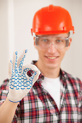 Image showing repairman making a perfect gesture with his gloved hand