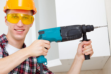 Image showing smiling worker with rock-drill