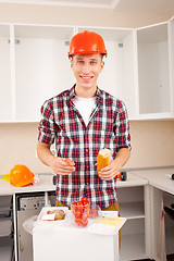 Image showing smiling worker dines