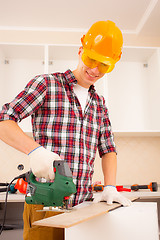 Image showing repairman with jigsaw