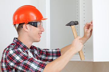 Image showing worker with a hammer