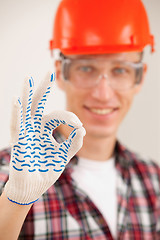 Image showing master making a perfect gesture with his gloved hand