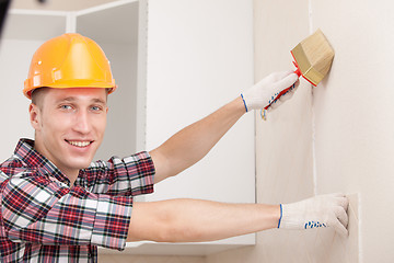 Image showing young worker with paint brush