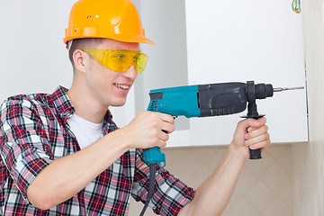 Image showing smiling worker with rock-drill