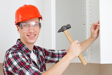 Image showing worker with a hammer