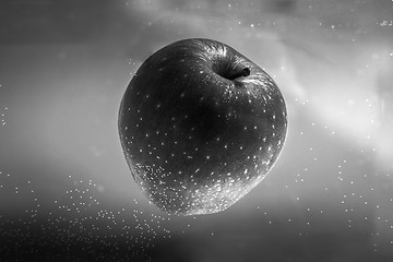 Image showing Small apple in see trough water