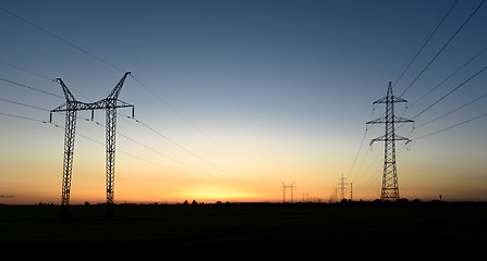 Image showing Large transmission towers at sunset