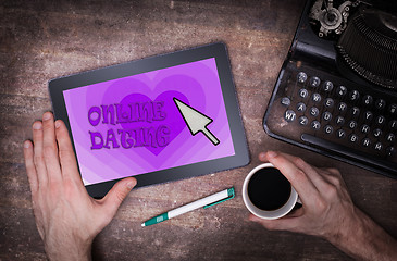 Image showing Online dating on a tablet