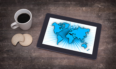 Image showing World map on a tablet