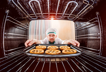 Image showing Chef cooking in the oven.