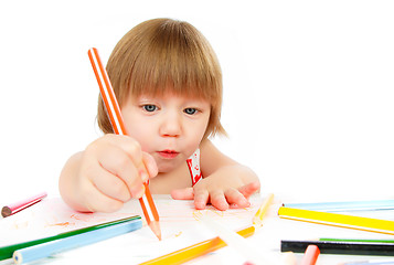 Image showing Little baby girl draws pencil