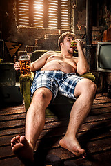 Image showing fat man eating hamburger