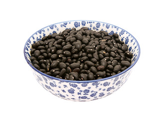 Image showing Black turtle beans in a blue and white china bowl