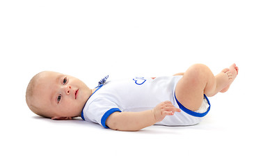 Image showing baby boy lying on white floor