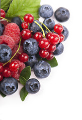 Image showing Many blueberries, raspberries. Isolated white