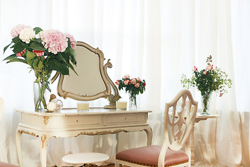 Image showing dressing table with flowers