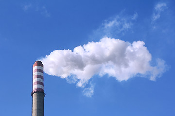 Image showing Smoke clouds from a high concrete chimney
