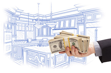 Image showing Hand Holding Cash Over Custom Kitchen Design Drawing