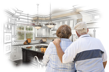 Image showing Senior Couple Looking Over Custom Kitchen Design Drawing and Pho