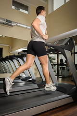 Image showing Man running on treadmill