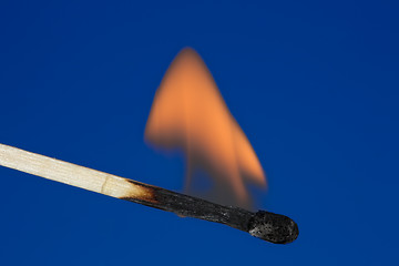Image showing Single burning match