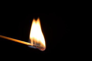 Image showing Single burning match