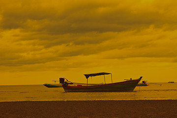 Image showing boat on the beach and sunset 