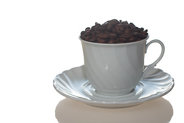 Image showing Coffee cup full of coffee beans