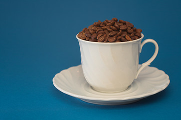 Image showing Coffee cup full of coffee beans