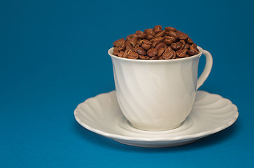 Image showing Coffee cup full of coffee beans