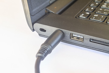 Image showing computer with power plug